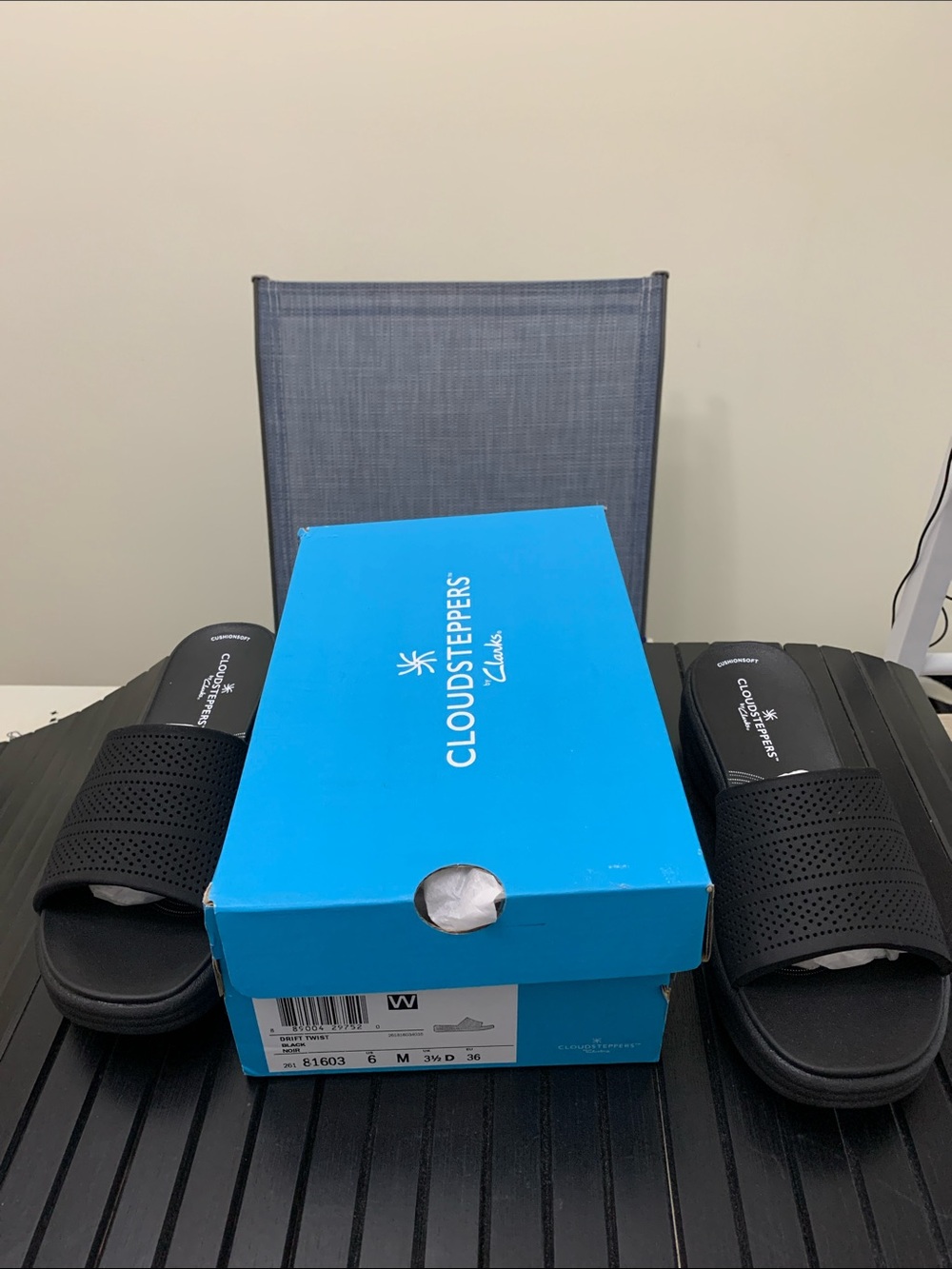 Clarks Black Slip-On Sandals with Wave-Textured Soles